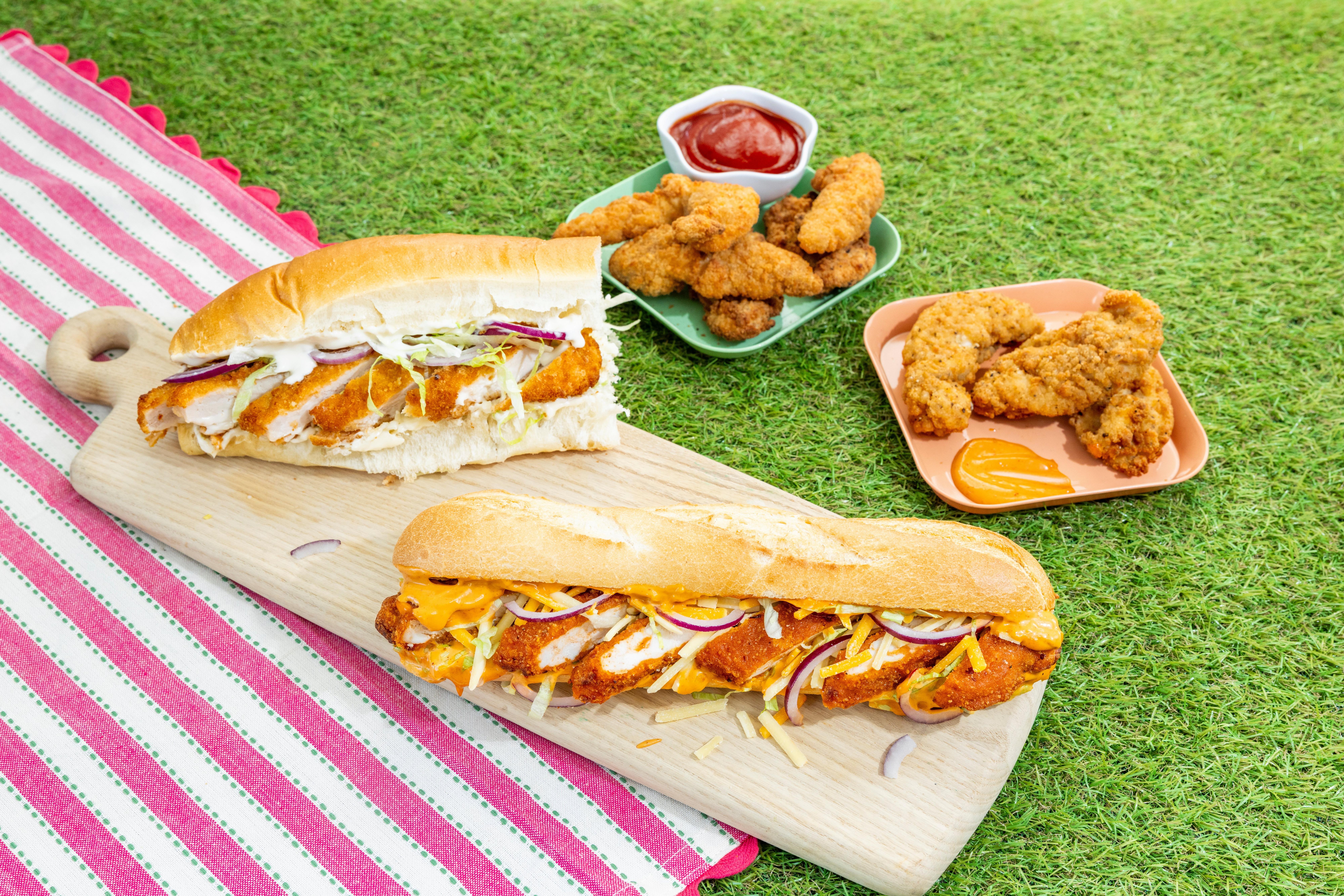 Deli food on a picnic blanket